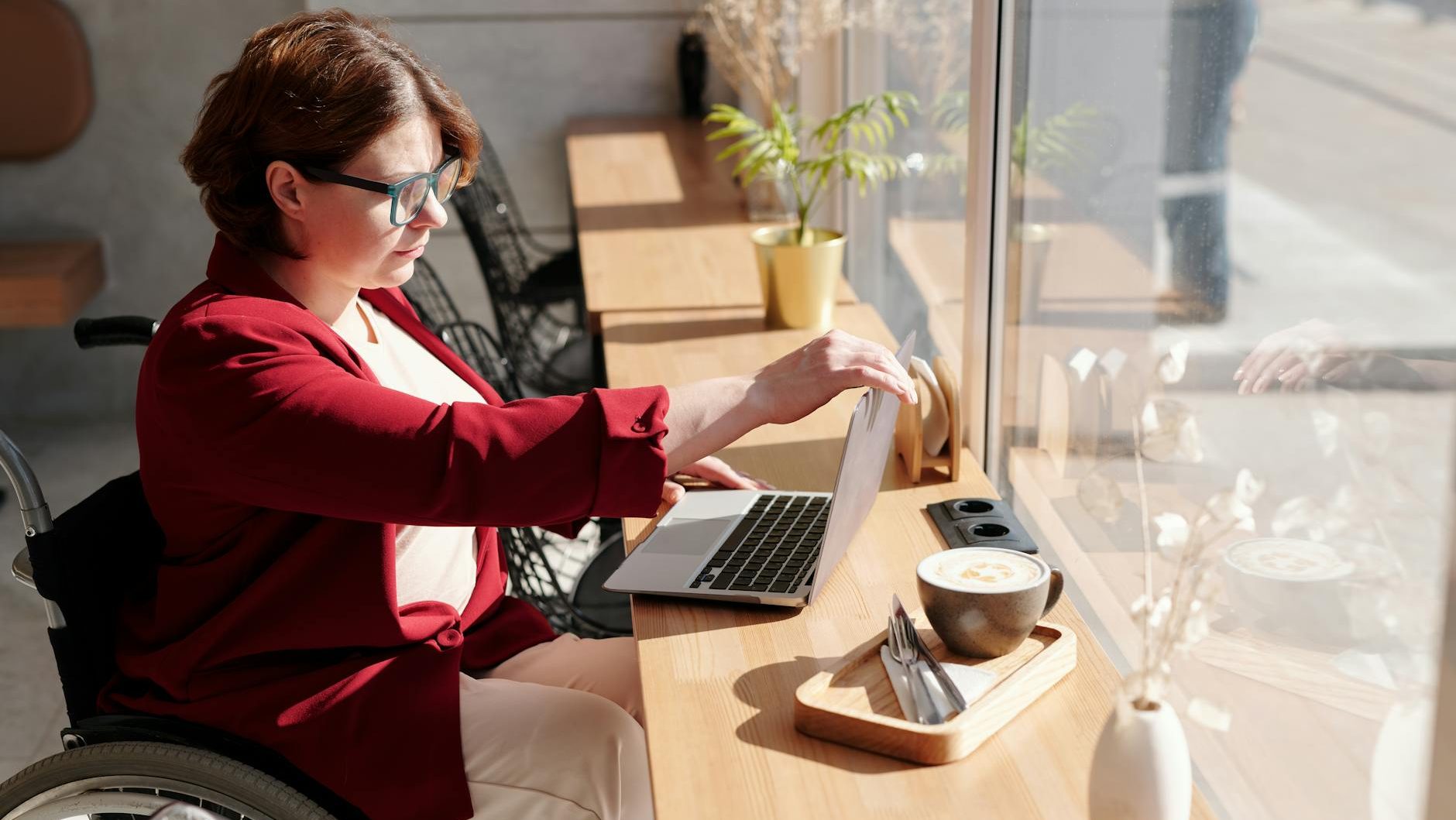 photo of woman using laptop