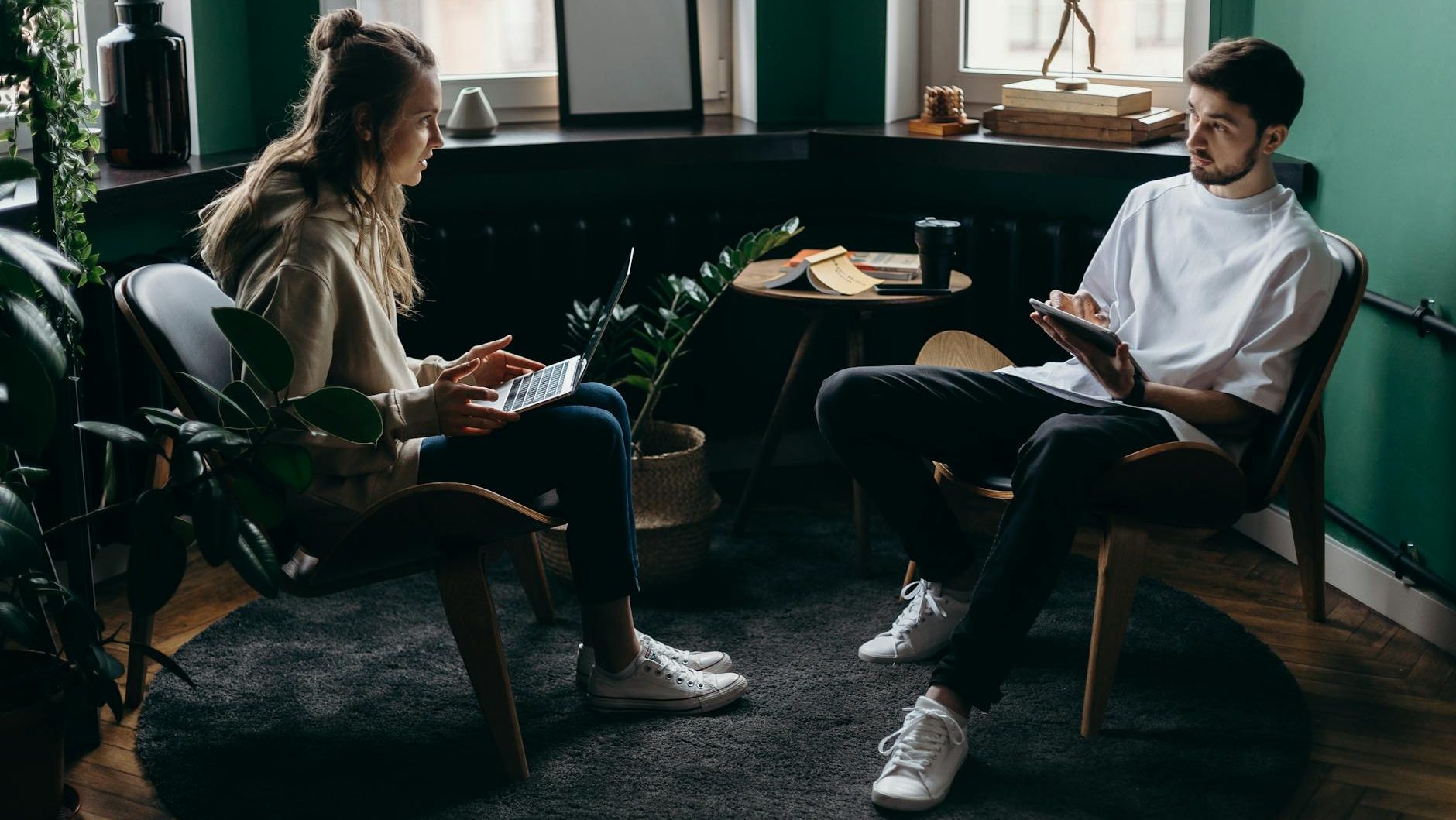 photo of man and woman talking to each other