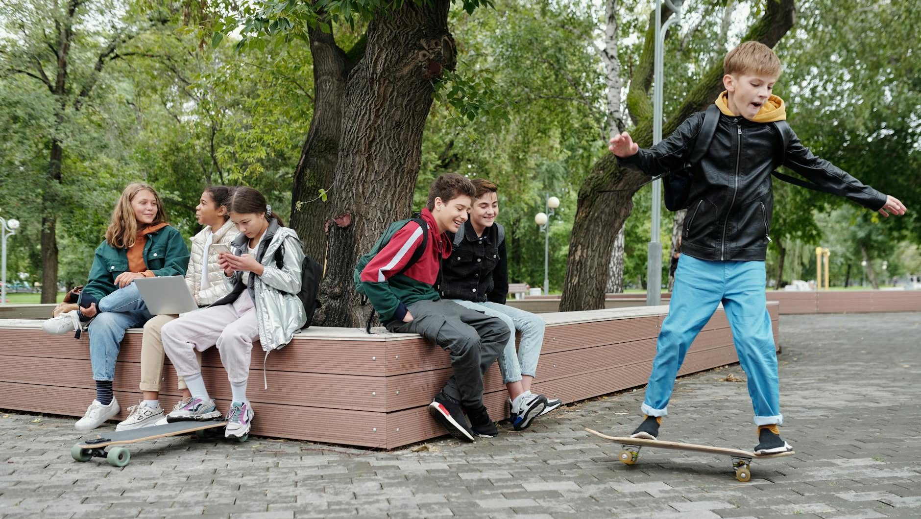 a young boy riding a skateboard